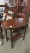 An Edwardian oval mahogany occasional table.