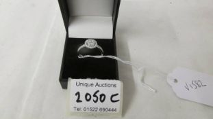 A 9ct white gold ring of separate carats (half carat in total), weight 2.4 grams, size P.