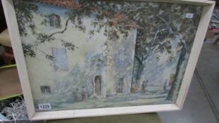 A framed and glazed watercolour of a continental street scene.