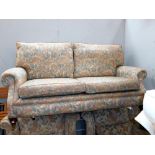 A 2 seater floral settee