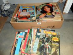 A box of vintage magazines including Scoop, Look-In, Titbits,