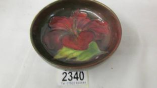 A Moorcroft HIbiscus Flambe' dish. ****Condition report**** No damage 117mm.