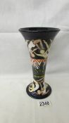 A Moorcroft Olympics vase, signed and dated 2011.