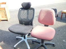 A pair of office chairs (adjustable heights)