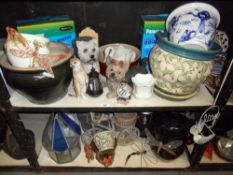 2 shelves of garden planters and garden ornaments, etc.