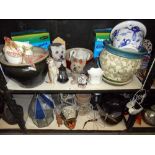 2 shelves of garden planters and garden ornaments, etc.