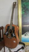 A vintage kay K550 acoustic guitar.