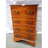 A teak effect 4 drawer chest/ hi fi cabinet.