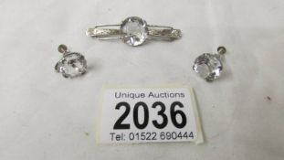 A vintage quality white paste brooch and screw back earrings (match lots 2034 and 2035).