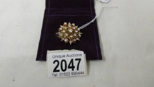 An 18ct gold diamond pendant/brooch. ****Condition report**** Size 32mm diameter.