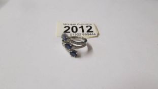 A large ornate 18ct white gold diamond and sapphire ring, size M, total approximate weight 6.