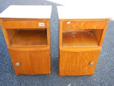 A pair of matching bedside cabinets
