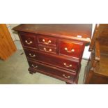 A 20th century mahogany chest of drawers with unusual configuration to drawers.