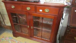 A good quality modern 2 door 3 drawer cabinet.