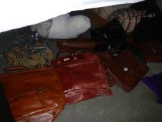 A large quantity leather briefcases, hold alls etc.