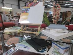 A good lot of artists items, including easel, pallette, acrylic paints, sketch books,