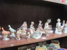 A mixed lot of figures including birds