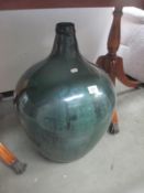 A large vintage green carboy bottle Height 62cm approx, top is not smooth,