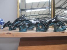 7 Poole pottery dolphins, 2 large (H 17.5cm) 1 medium (H 14.5cm) and 4 small (H 10.