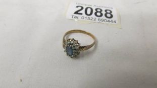 A 9ct yellow gold and topaz ring, size M.