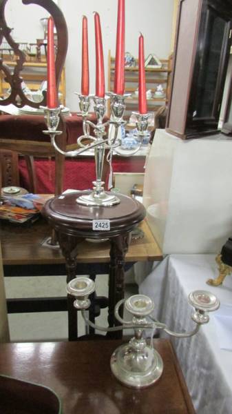 Two silver plate candelabra.