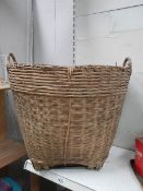 A wicker log basket.