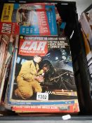 A box of car magazines.