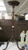 A mahogany tripod pot/lamp stand.