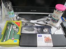 A boxed Denby carving knife and fork set and lot of cutlery,
