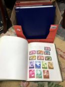 5 albums of stamps including Canada, UK, world etc.