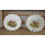 A pair of Royal Crown derby plates hand painted with hunting scenes.