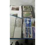 2 albums of assorted postcards.