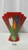 An Anita Harris Studio Pottery fan vase in the crocus design, 23 cm tall, signed in gold to base.