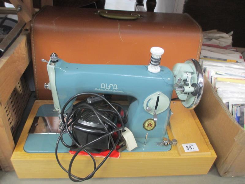 An Alfa 50 electric sewing machine with case,