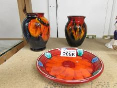 2 Poole Pottery vases and a Poole pottery tray,