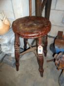 A 19th century early 20th century wooden stool with cross stretcher height 52cm
