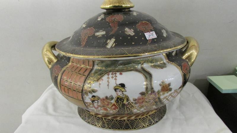 A large oriental hand painted tureen.