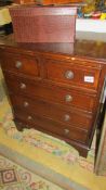 A 2 over 3 mahogany chest of drawers.