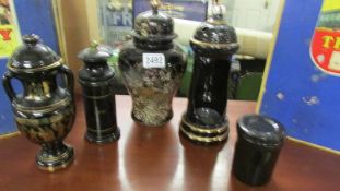 2 lidded vases and 3 other items.