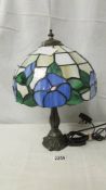 A table lamp with Tiffany style shade.