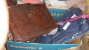 A large box of briefcases etc.