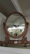 A good quality Victorian mahogany oval toilet mirror.