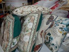 A good lot of embroidered and other cushions.