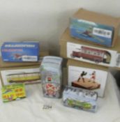 A collection of 6 boxed tin plate toys.
