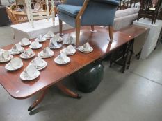 A walnut veneer top darkwood stained dining table 183cm x 91.