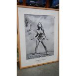 A framed and glazed Raquel Welch poster 'One Million Years BC'. 63 x 83 cm.