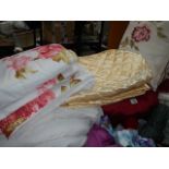 A quantity of quilts, cushions etc.