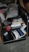 A large quantity of new socks, handkerchiefs etc., in a briefcase.