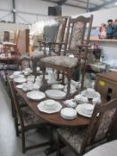 An oak extending dining table and 6 chairs, 97cm x 207cm extended,