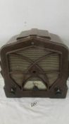 An old bakelite radio case with modern transister movement,, in working order.